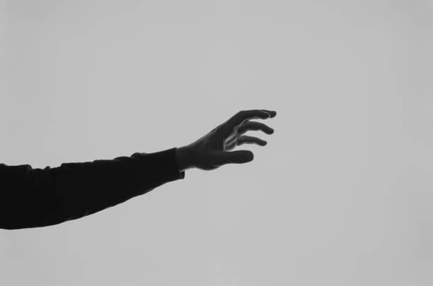 istock Hand emotion silhouette black and white 1256850669