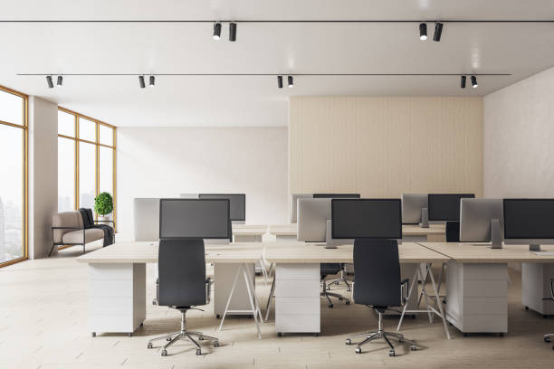 istock Modern coworking office room with personal computers 1256850684