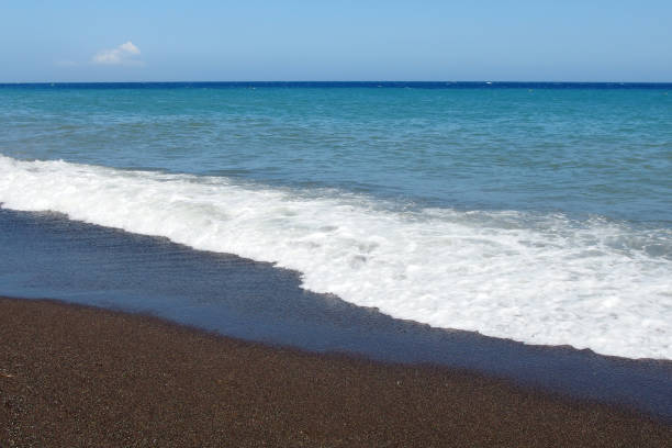 istock volcanic sandy beach on Santorini island 1256853858