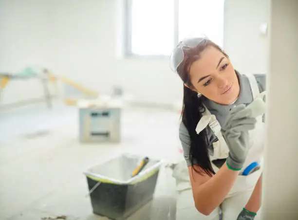 Photo of female house painter