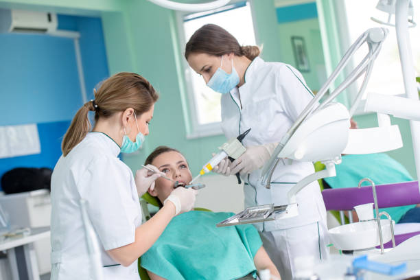 istock Dentist and patient in dentist office 1256859075