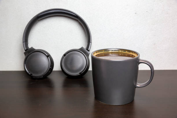 istock coffee cup and headphone on wooden table 1256860176