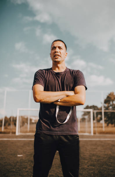 Confident Soccer Coach Posing for Photography