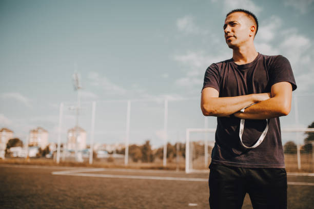 istock Confident Soccer Coach Posing for Photography 1256864035