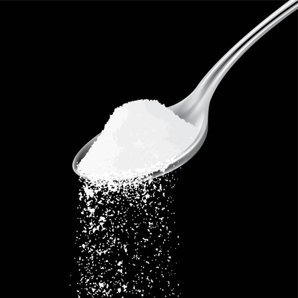 salt spoon pouring salt from spoon in black background salt pile stock illustrations