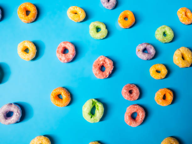 istock many colorful sugary cereal grains on a blue background 1256865739