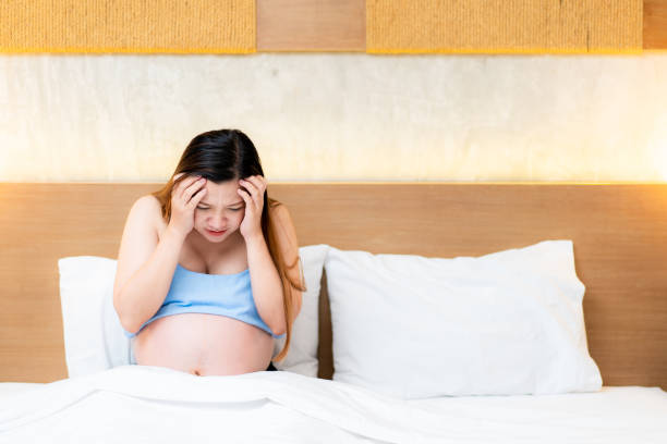 istock Unhappy pregnant woman 1256868624