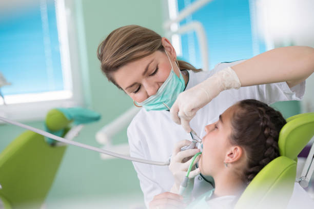 istock Dentist and patient in dentist office 1256869394