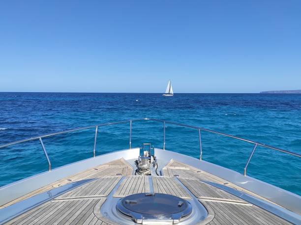 view if yacht bow sailing in turquoise water in ibiza, spain - yacht luxury front view ships bow imagens e fotografias de stock