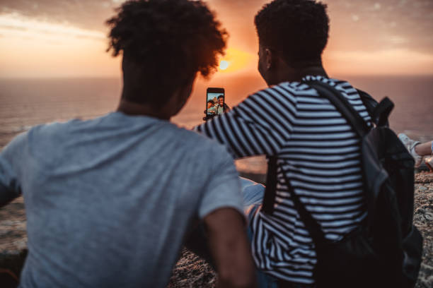 istock Two young taking selfie in the sunset 1256870815