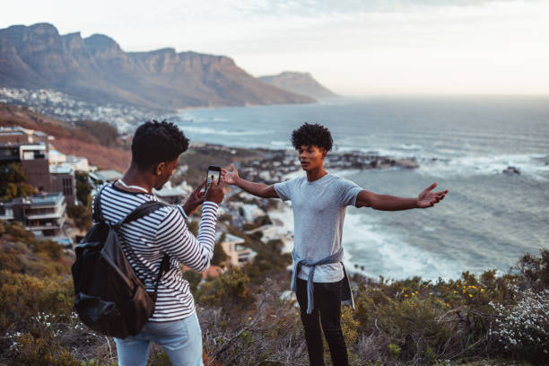 istock Young man posing for a photo to his friend 1256871023