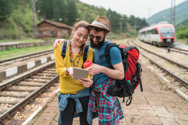 istock Young couple going on a camping trip in the mountains 1256871946