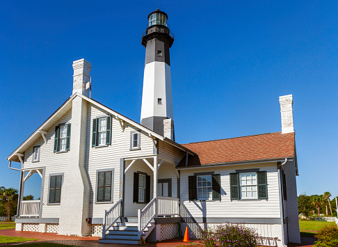 The restored Tybee Island Light Station and surrounding buildings. The lighthouse has 178 steps and is next to the Savannah River Entrance, on the northeast end of Tybee Island, Georgia