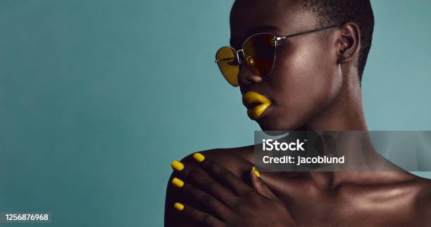 Female Model Bright Makeup And Sunglasses Stock Photo - Download Image Now - Melanin, Sunglasses, Shaved Head