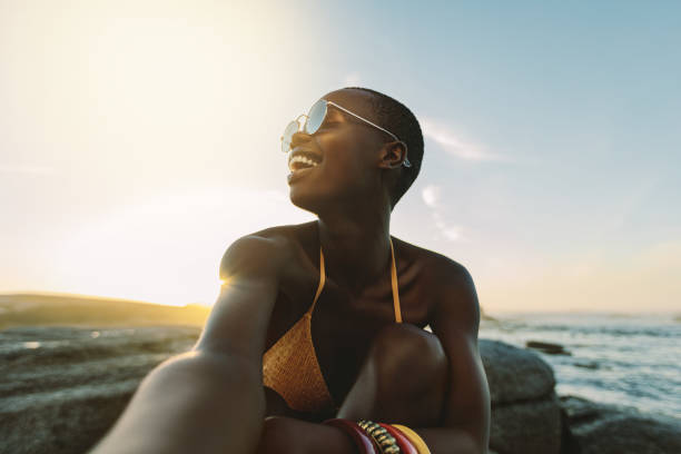 istock Woman having great time on beach vacation 1256878242