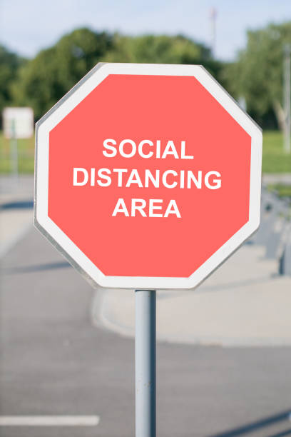 istock social distancing area sign 1256883332