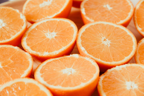 istock Bunch of fresh sliced oranges on a tray 1256883657