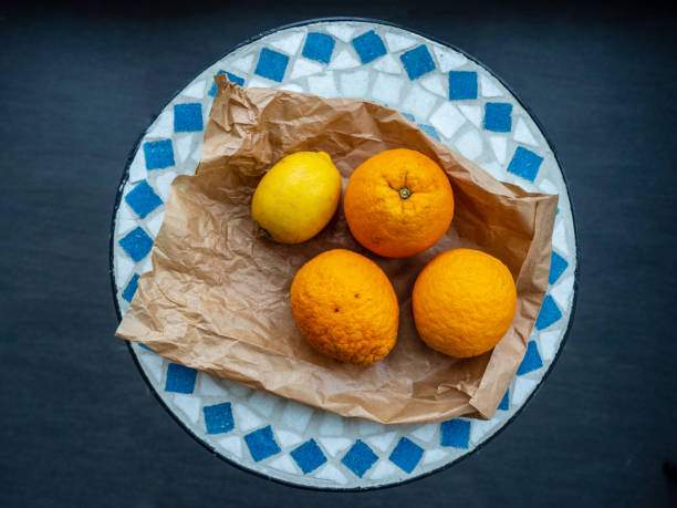 istock Arrangement of lemons and oranges 1256884295