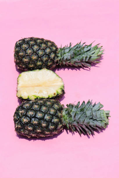 istock Pineapples Isolated on Pink Background, Perfect for Wallpaper 1256884340