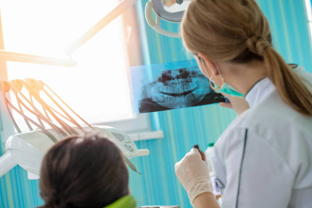istock Dentist and patient in dentist office 1256885619