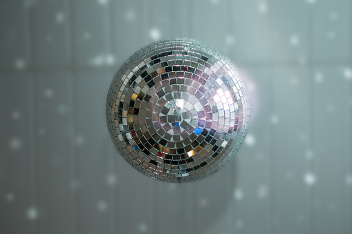 close up mirror ball or Christmas ball to decorative for Christmas festival with bokeh golden tone background. Have some space for write wording
