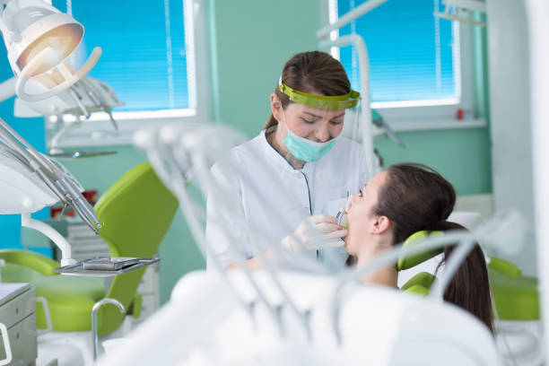 istock Dentist and patient in dentist office 1256886042