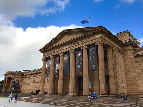 January 3, 2018 - Sydney, Australia: General front view of Art Gallery of New South Wales, people walking inside in a blue sunny day.\n\nArt Gallery of New South Wales in Sydney in summer sunshine. The museum was established in 1880 and is considered to be the most important gallery in Sydney and the fourth largest in Australia. It displays Australian, European, and Asian artwork.