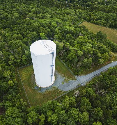 Aerial drone view of a town's water storage tank.