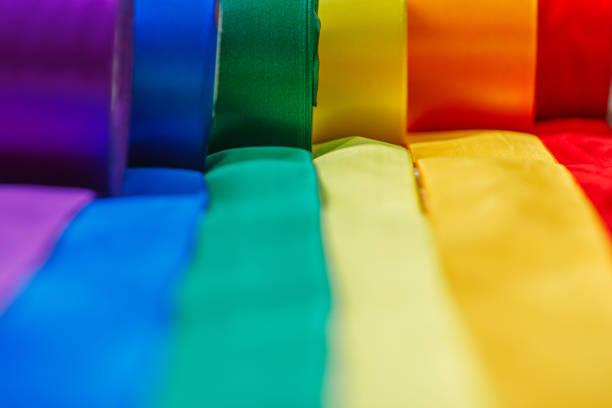 ribbons in rainbow lgbt flag color in bobins are rolled out using how to celebrate gay, gay, lesbian and concept ribbons in rainbow lgbt flag color in bobins are rolled out using how to celebrate gay, gay, lesbian and concept rainbow flag photos stock pictures, royalty-free photos & images