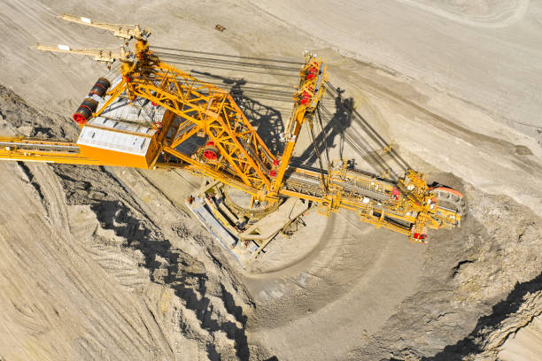 istock Top view of a bucket wheel excavator mining coal in an open pit mine. 1256895950