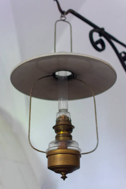 istock antique oil copper lamp hanging by the wall 1256899664