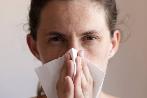 istock Women Cleaning Her Nose 1256902636