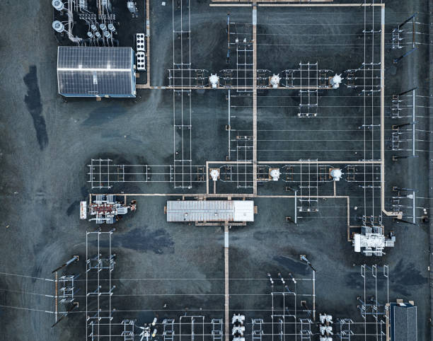 Power Substation Aerial drone view of a high voltage power substation. electricity substation stock pictures, royalty-free photos & images