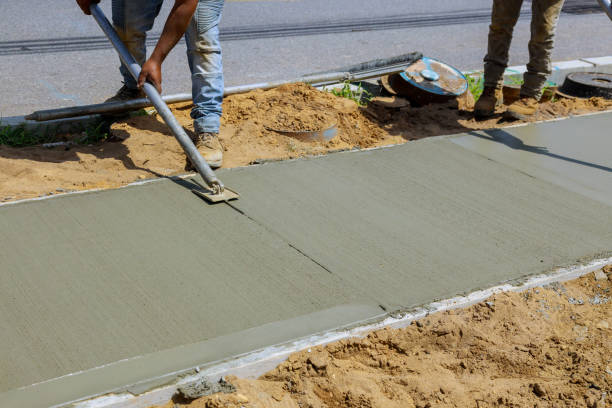 istock Construction of new sidewalks laying concrete cement 1256905910