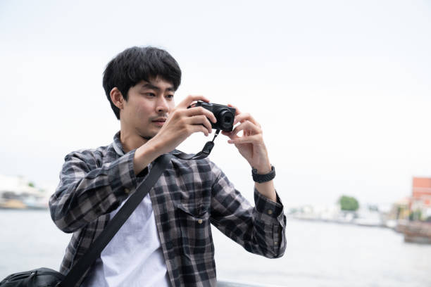 istock Man taking photograph skyline. 1256906042