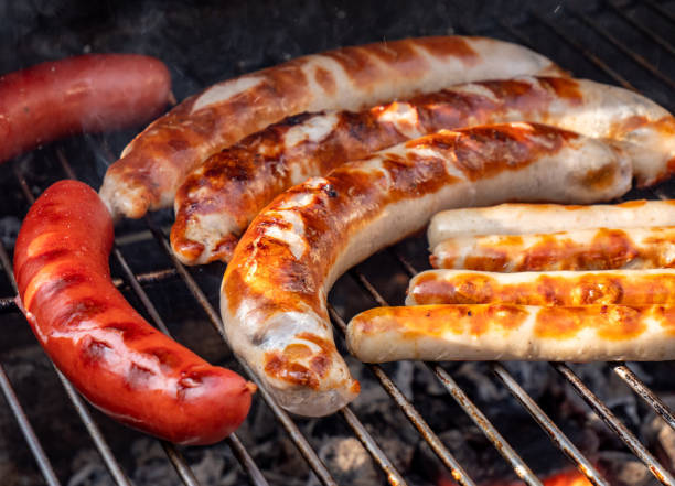 Barbecue with sausage in the garden