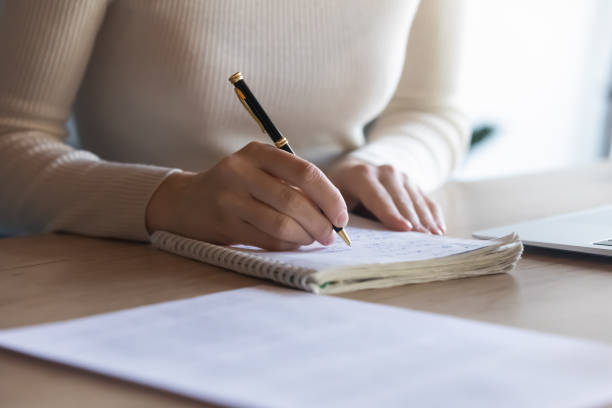Businesswoman writing important data information creative startup ideas closeup