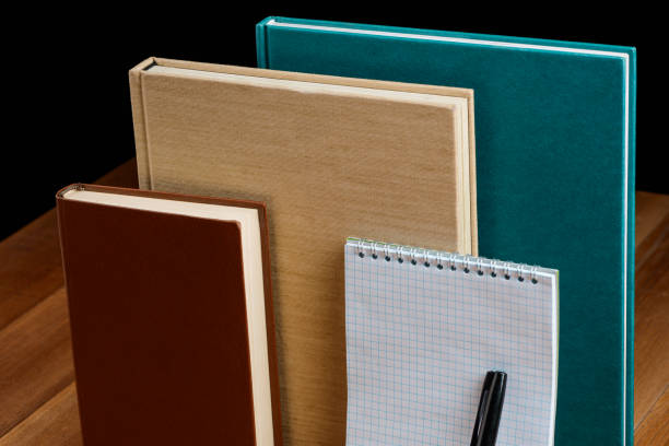 istock Hardcover books, diary and notepad. Various colors and sizes 1256910783