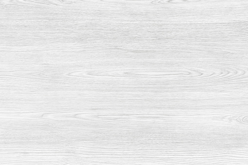 White wood background. A wood grain pattern featuring even grains of wood running horizontally across the image. The board is new and clean.