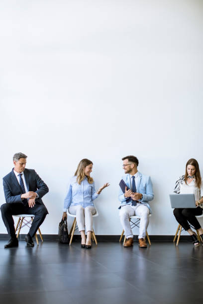 istock People sitting in the waiting room  before an interview 1256912423