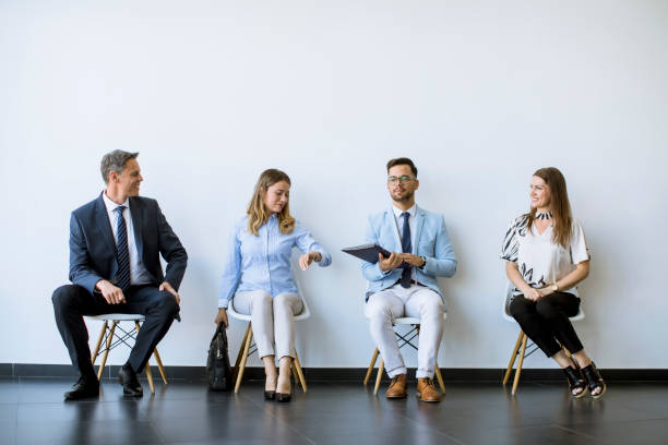 istock People sitting in the waiting room  before an interview 1256912424
