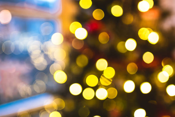 istock Blurred christmas tree background with garland lights. 1256914083