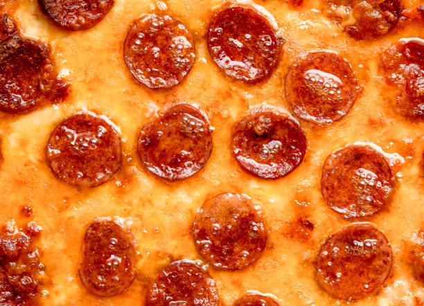 Pizza pepperoni top view close-up. Tasty homemade pizza with salami