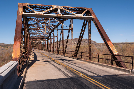 The Gillespie Dam Bridge was built in 1927 on US 80 to span the Gila River in Arlington, Maricopa County, Arizona.  It is part of the Ocean-to-Ocean Highway which was established in 1911.