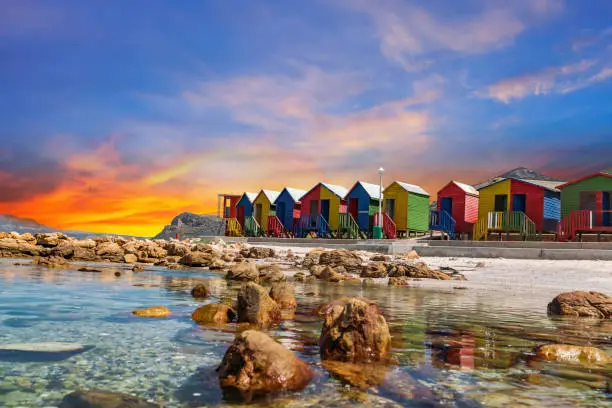 Photo of Muizenberg beach huts wooden cabins at twilight