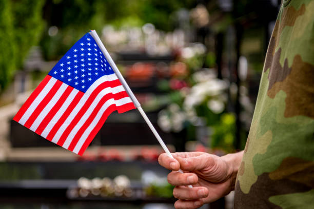 istock Soldier standing at cemetary 1256916784
