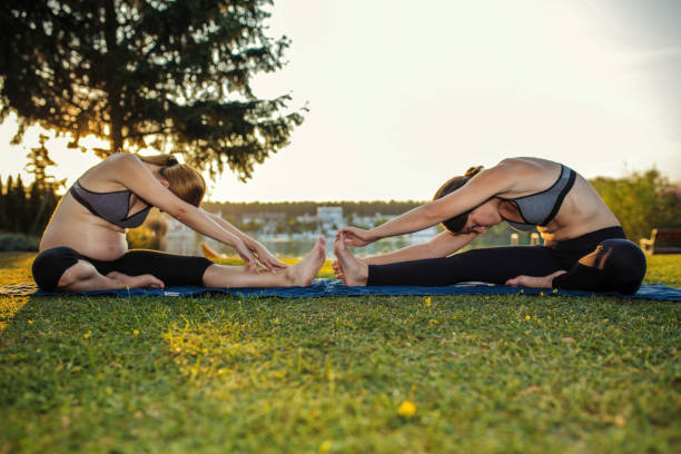 istock Personal trainer works with pregnant woman 1256919647