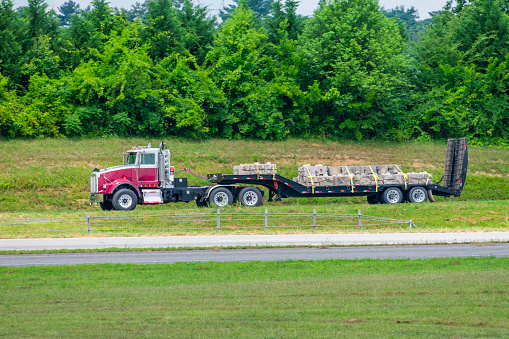 Flatbed 18-Wheeler Carrying Load of Stone For Construction