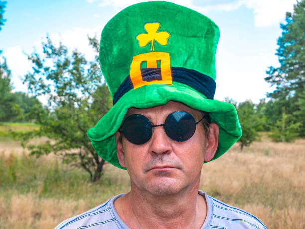 istock A man wearing a st patrick hat and sunglasses. 1256921628