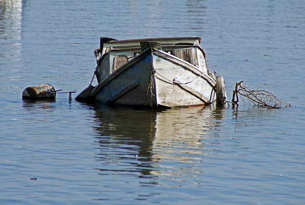 istock Abaandoned boat sunken in river 1256921951